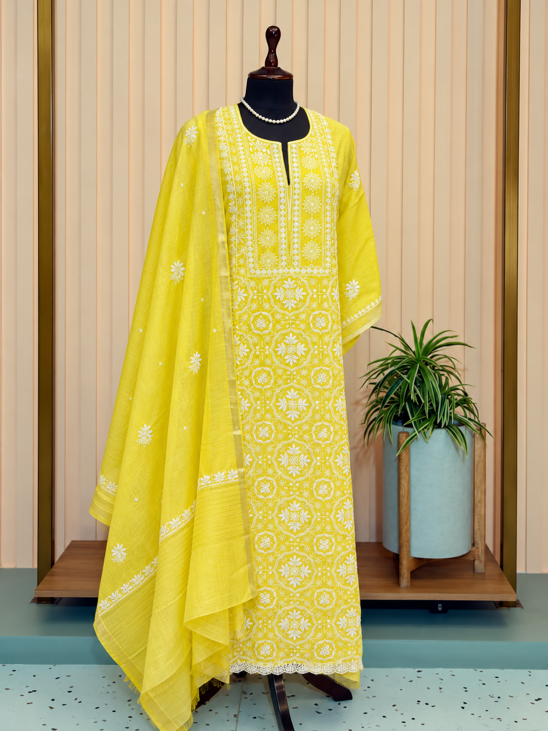 Daffodil Yellow Chikankari Suit - Unstitched – mannequin display showing chikankari embroidery and fabric detail